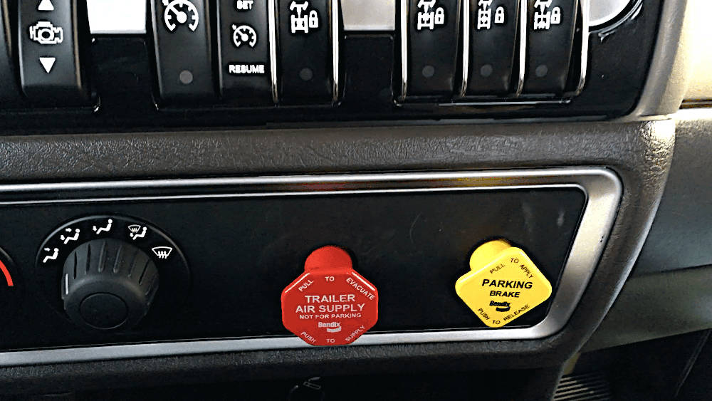 The red and yellow buttons on the dash of your air brake vehicle control the parking brakes on the truck and trailer.