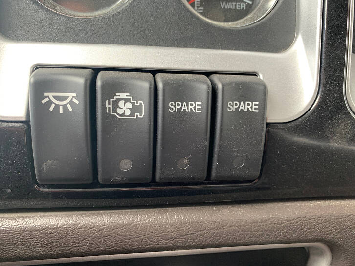 The cabin lights switch and the engine fan switch. You can manually turn on the engine's fan.