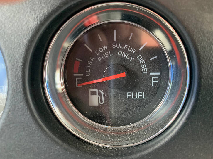 The fuel gauge indicates how much diesel fuel is in the tanks. Keep it above 1/4 tank when driving professionally.