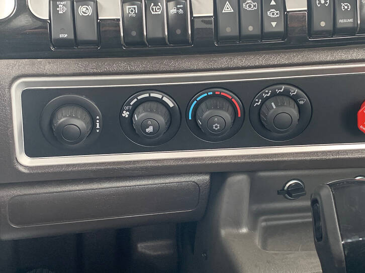 The temperature controls for the heat and air conditioning in the cabin, as well as your dial for the truck computer systems.