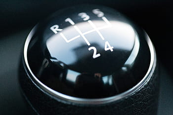 To select reverse in this car, it is over to the left and up. Some times there is a locking ring on the selector that has to be pulled up so it will go into reverse gear.