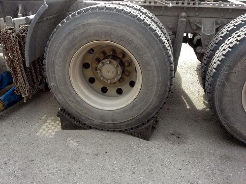 Before any pre-trip inspection on air brakes, ensure that the wheels are chocked and the vehicle is secure.