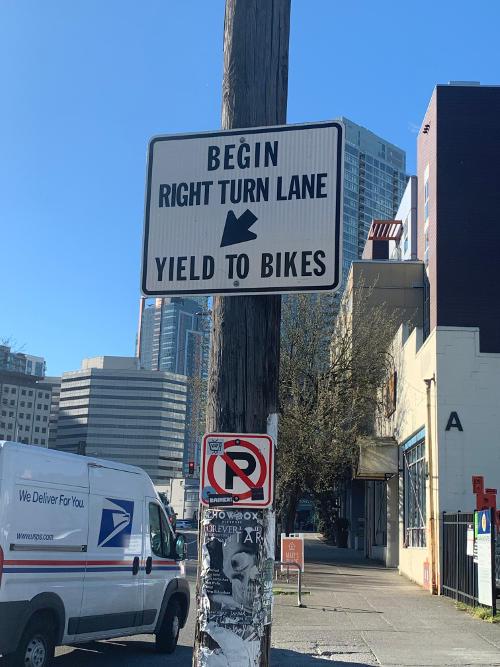Bicycle regulatory sign in Seattle, WA, USA telling drivers to give the right-of-way to cyclists.