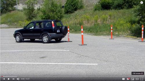After practicing for a bit getting the vehicle between the cones, back from the passenger side to improve your skills.