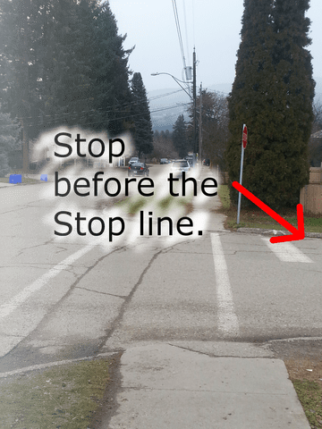 On a road test, you MUST stop at the correct stopping position at controlled intersections: before STOP line; before crosswalk lines or sidewalk; at the edge where two roads meet.