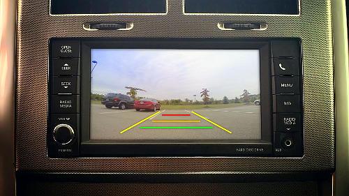 Even though you have a backup camera, still look out through the back when reversing. And do a 360° scan before you begin reversing to check the environment around your vehicle.