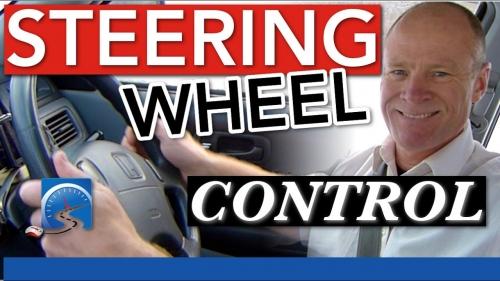 Unless you're shifting gears or reversing the vehicle, you must have 2 hands on the steering wheel for the duration of your driver's test.