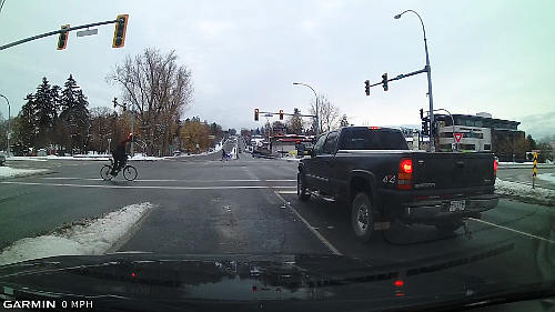 Even in the winter, there may be cyclists vying for road space at intersections and along the road.