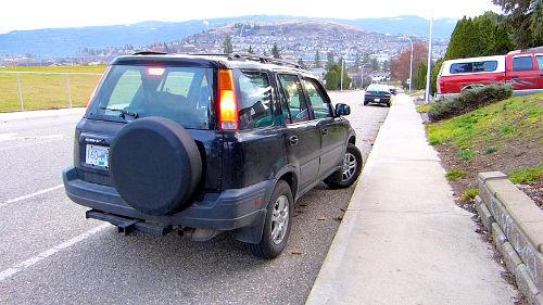 Parking downhill with a curb. When parking dowhill with a curb, the steer tires are turned all the way to the right and then the vehicle is allowed to roll against the curb so that it is secured against movement.