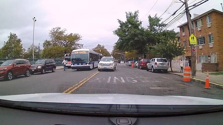 Double parked car and other vehicles in your lane is another traffic situation you'll deal with on your test.